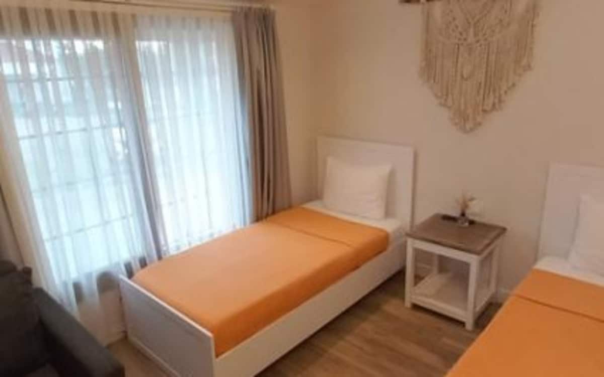Dreibettzimmer mit getrennten Betten